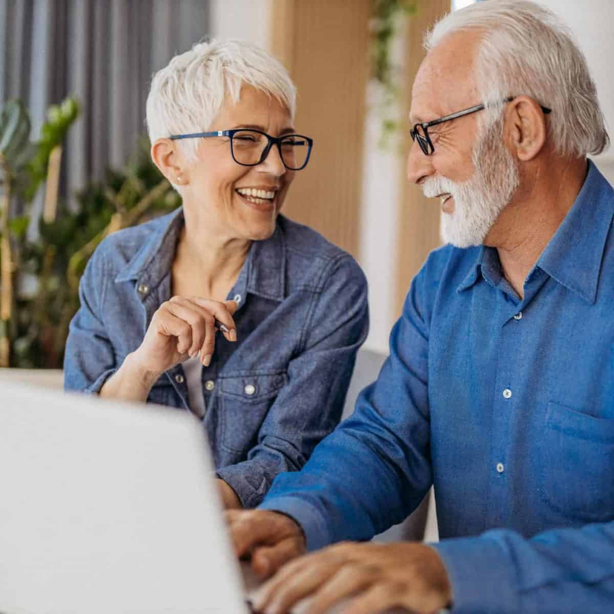 Cleveland Precious Metals IRA & Investing Company Copy of Senior couple at laptop smiling GettyImages 1323096524 1200x1200 1